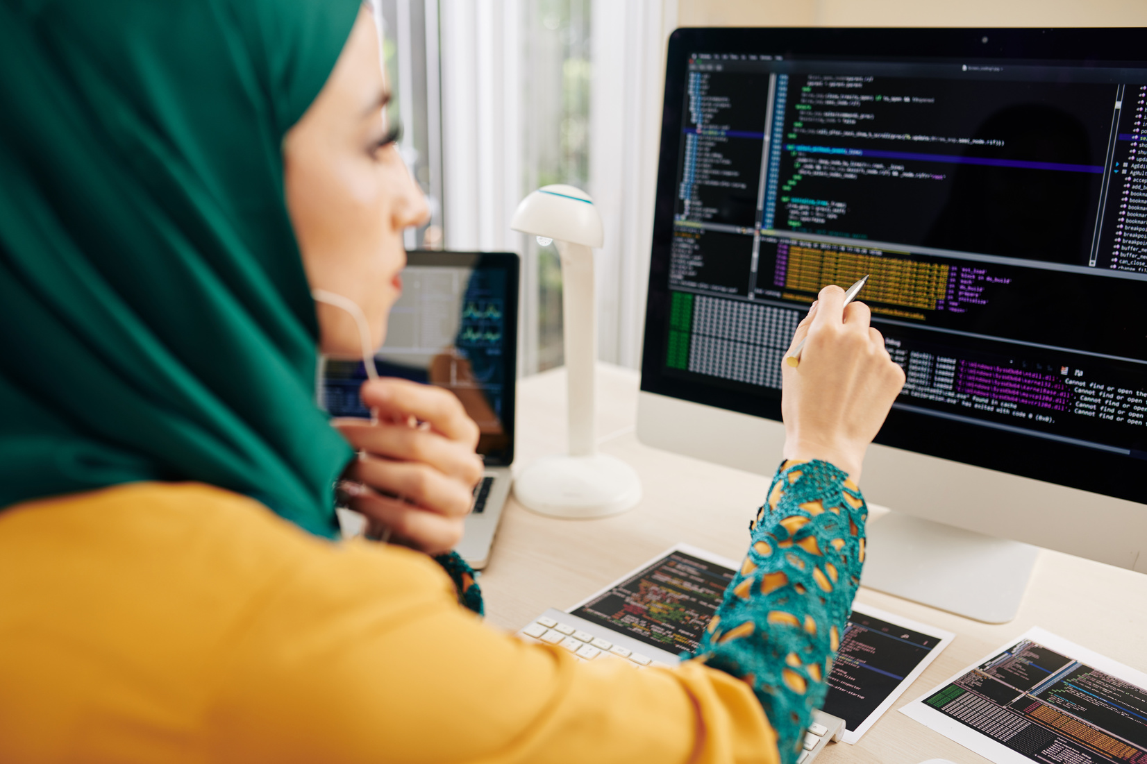 Female Programmer Checking Code